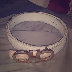A white & gold Ferragamo belt